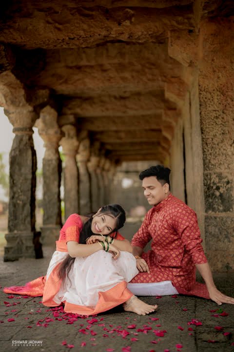 Couple seated on the stone floor, laughing together