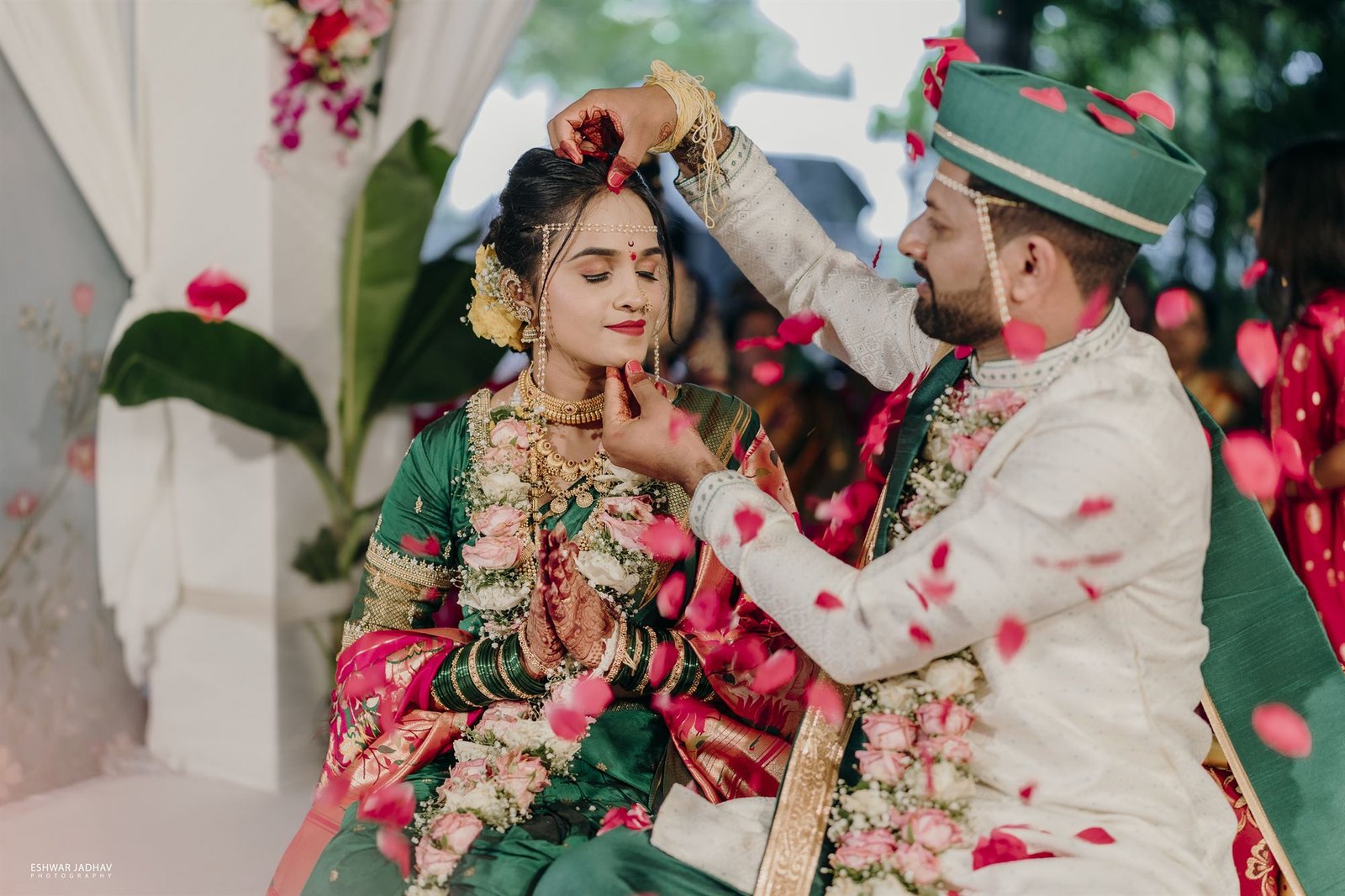 Bride and groom exchanging garlands during a traditional Indian wedding ceremony